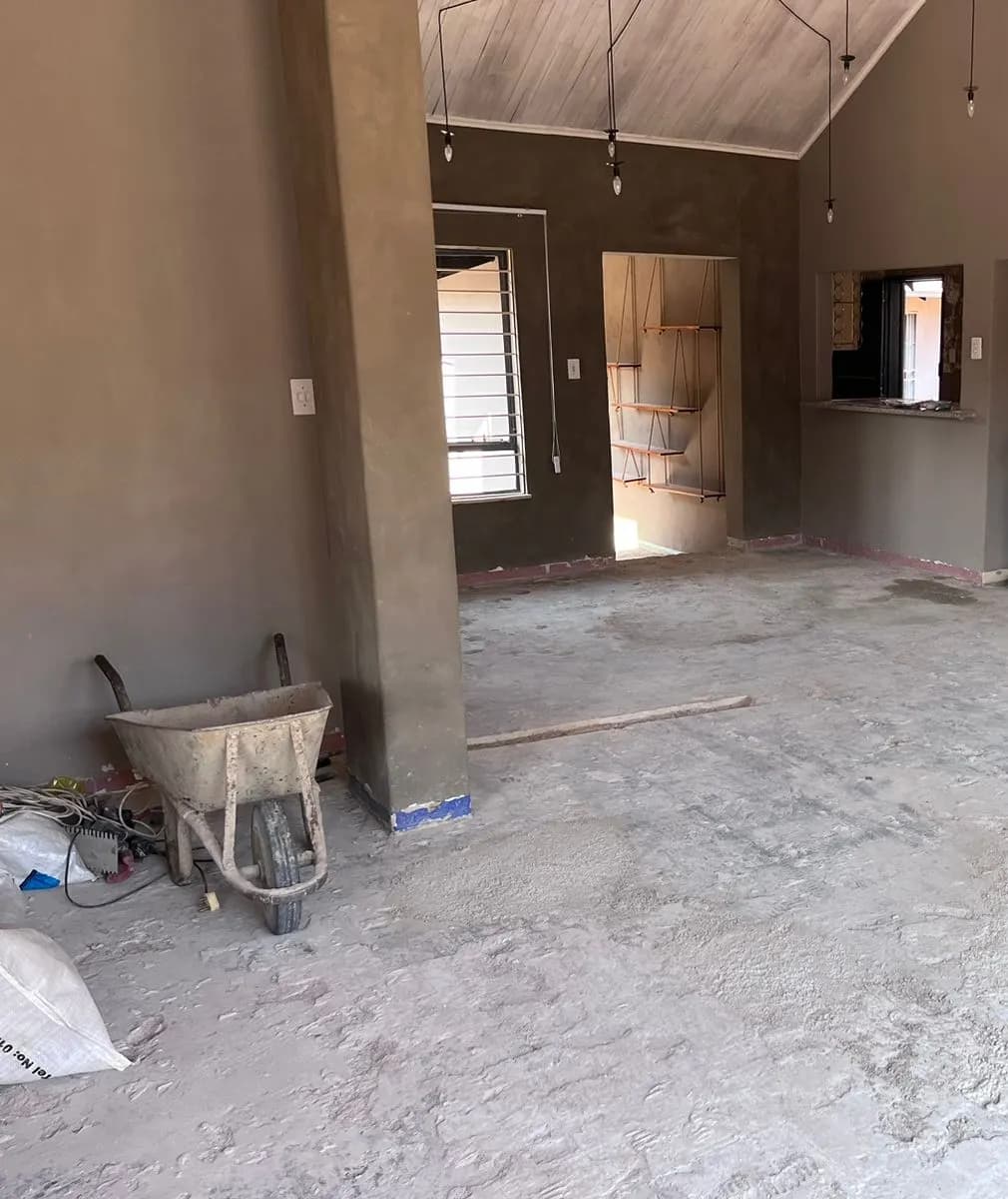 During: old floor tiles lifted and the floor prepared and screeded before tiling