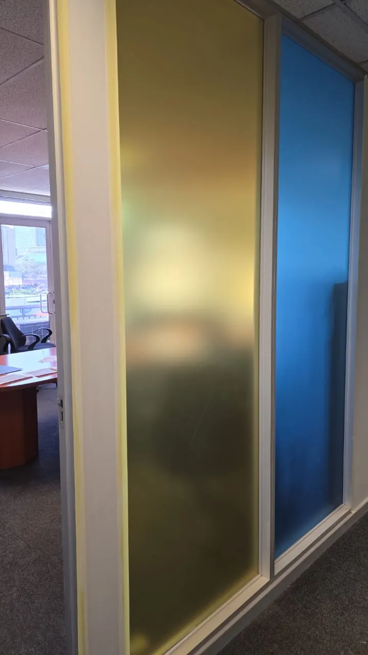 Office with coloured frosted glass partition panels