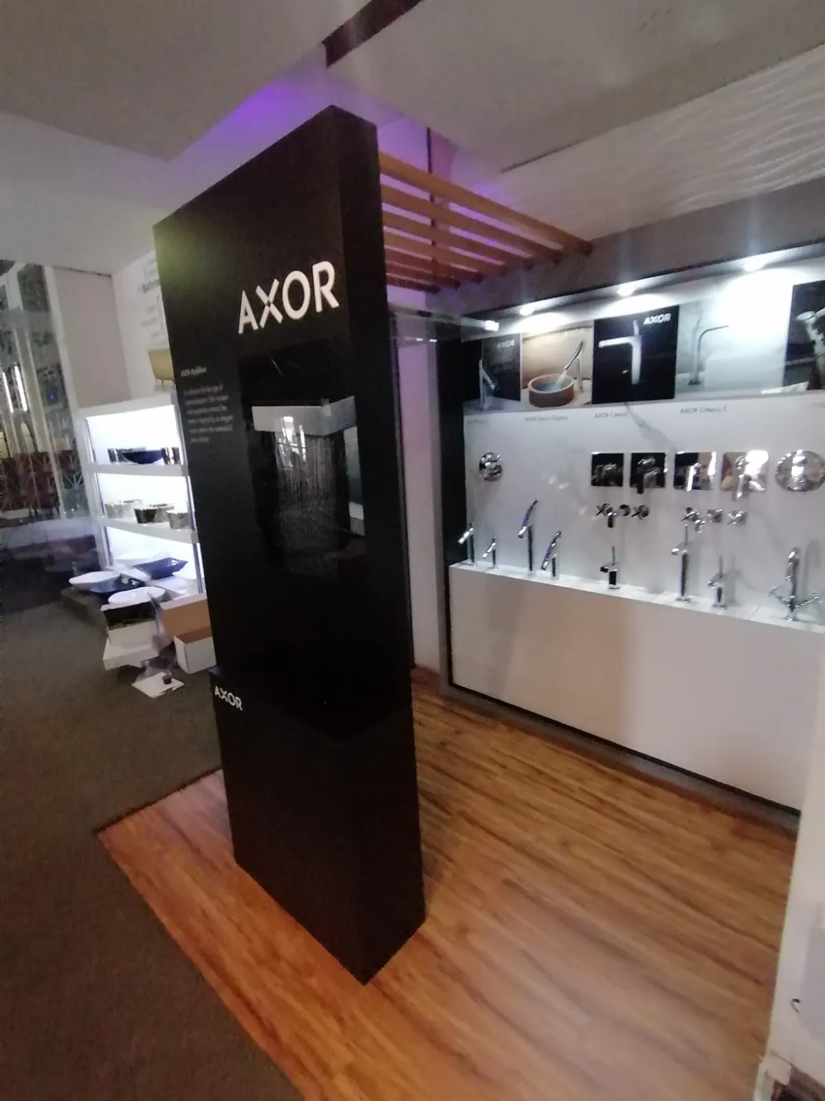 Showroom display bay with a black column and timber slat canopy